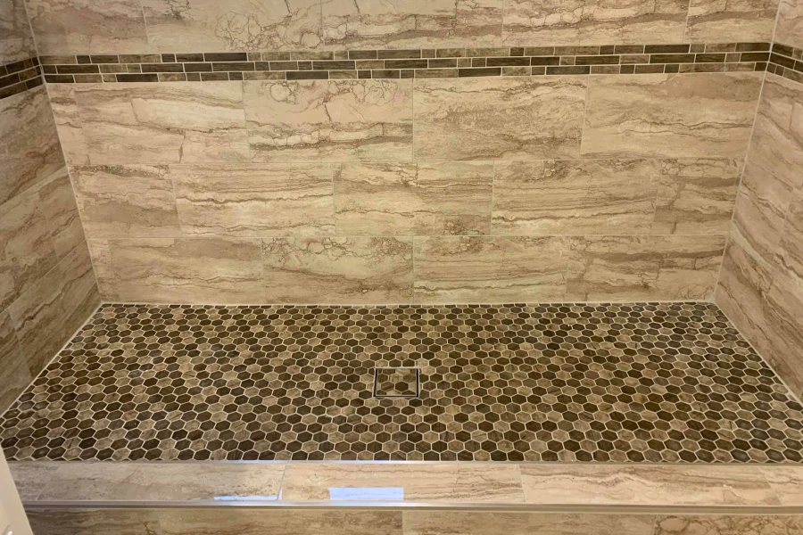 close up of tile installation on a bathroom shower area